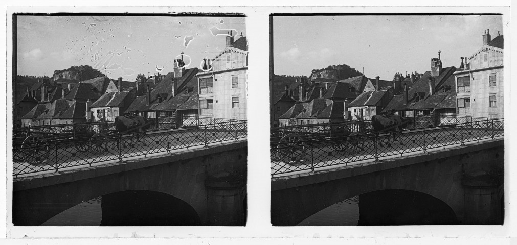 Voiture tirée par un bœuf sur le pont